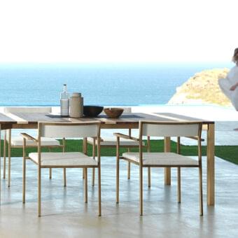 Distinctive Talenti Casilda armchair with pale neutral textile and matte powder coated stainless steel frame including stone inserts