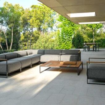 Distinguished Talenti Casilda coffee table with a warm wood top and creatively combined stone slats in a dark finish