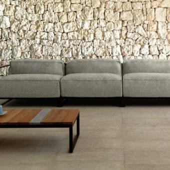 Distinguished Talenti Casilda coffee table with a dark matte stainless steel structure and lighter-toned wood slat detail
