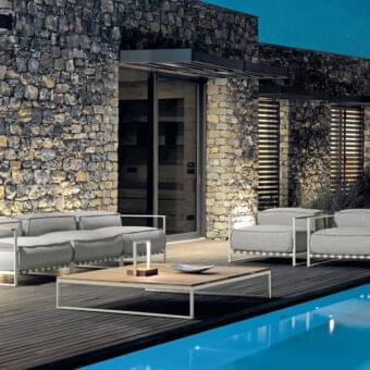 Sophisticated Talenti Casilda sectional with plush gray cushions and light-colored matte stainless steel frame