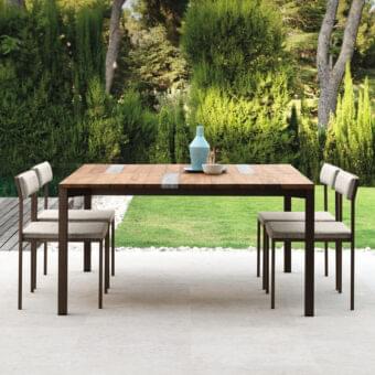 Sophisticated Talenti Casilda table crafted with dark bronze powder-coated stainless steel and wood combined with matching stone slats