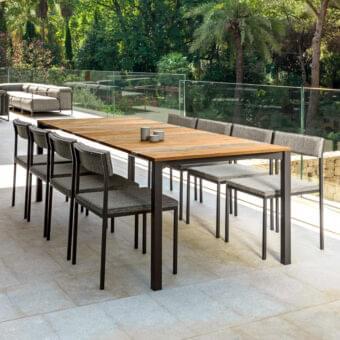 Distinguished Talenti Casilda table with rectangular wood top and dark gray powder-coated stainless steel stone slats