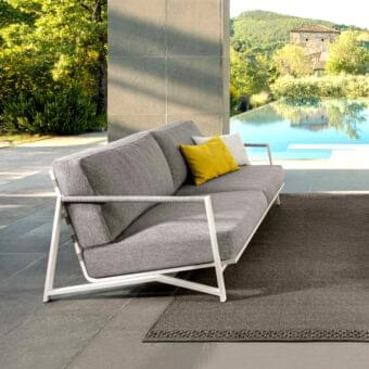 Distinguished Talenti Cottage sofa with aluminum frame, textured gray fabric cushions, and nautical rope detailing