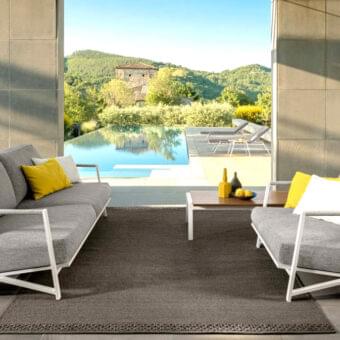 Distinguished Talenti Cottage sofa with light-colored aluminum frame, plush gray textile cushions and nautical rope detailing with matte finish