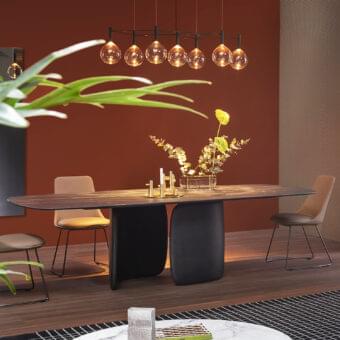 Sophisticated Bonaldo Mellow table with curvilinear forms and dark-toned wood exhibiting a smooth satin finish