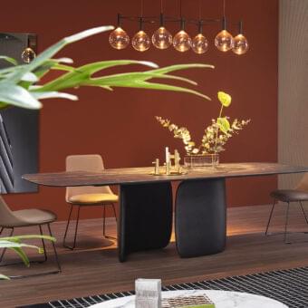 Distinguished Bonaldo Mellow table with a dark matte top and volumetric rigid polyurethane base offering an organic silhouette