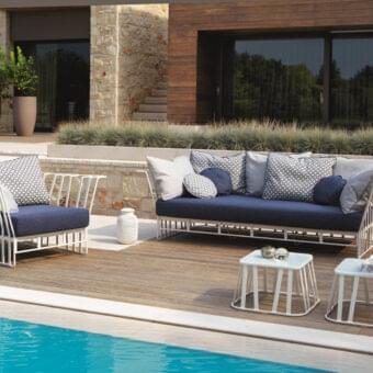 Distinguished Roberti Rattan Hamptons Graphics sofa with a powder-coated aluminum structure and dark blue textile seat cushion