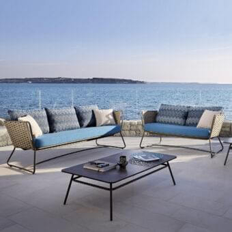 Superior Roberti Rattan Portofino sofa with tan Nautic Rope and light blue outdoor fabric cushions crafted with a powder-coated aluminum frame