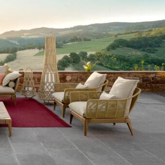 Distinguished Talenti Cruise lounge chair with satin-finish teak wood frame and weather-resistant fabric in a light beige tone