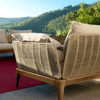 Exceptional Talenti Cruise sofa with light tan teak wood framing and woven synthetic rope detailing, built with light beige weather-resistant cushions