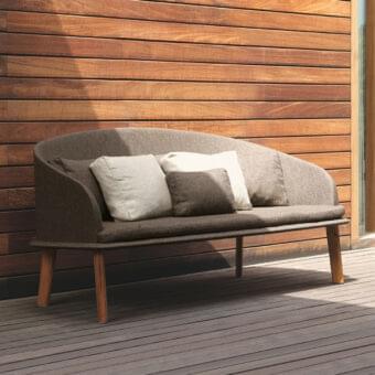 Sophisticated Talenti Cleo sofa with a warm medium-brown wood frame and plush removable gray textile cushions