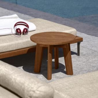 Distinguished Talenti Cleo side table crafted in natural teak wood with a warm medium-toned brown hue and rounded form
