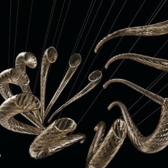 Distinguished Barovier&Toso Swing ceiling lamp with golden reflective Murano glass elements and thin steel cables crafting a dynamic sculptural arrangement