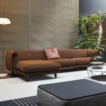 Distinguished Bonaldo Saddle sectional with reddish-brown textured textile and darker brown leather accents built on sleek metal legs