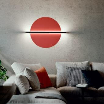 Innovative Penta Hang Out wall lamp with a muted red circular panel and sleek black metal bar crafted in Italy