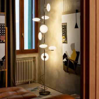 Distinguished Penta Mami floor to ceiling lamp with slender metal and refined blown white glass shades in brushed bronze finish