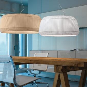 Superior Modo Luce Loto suspension lamp with a gracefully shaped pleated fabric lampshade emitting a soft diffused glow