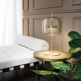 Superior Vistosi Jube table lamp with rounded clear blown glass diffuser and glossy golden metal components