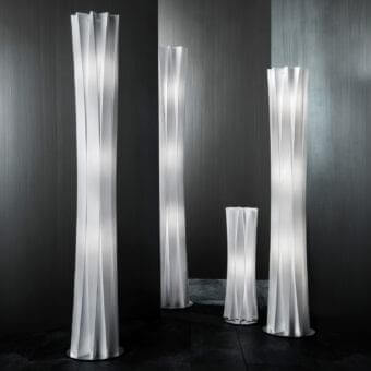 Distinguished Slamp Bach floor lamp with gently twisting Opalflex® and pale off-white color creating a soft ambient glow