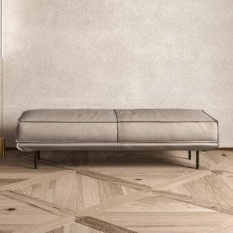 Sophisticated Presotto Cali bench with light gray leather upholstery and slim dark matte black metal legs
