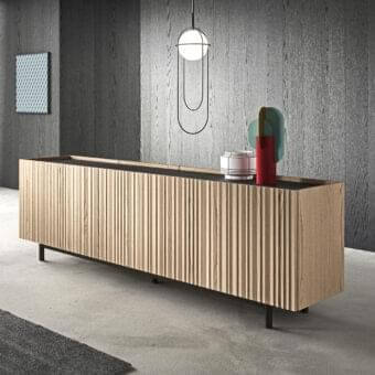 Distinguished Presotto Ori sideboard crafted with pleated wood veneer doors and a glossy wood tone top with a dark metal base