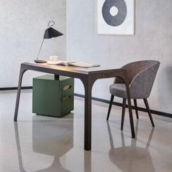 Distinguished Presotto Relevè desk crafted in dark oak veneer with a satin finish and a uniquely resting leg built upon a coordinating unit