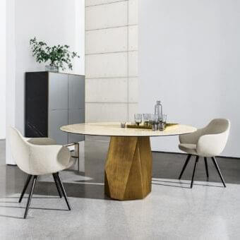 Superior Sovet Italia Cadira armchair with light beige textile upholstery and lacquered dark metal coned legs