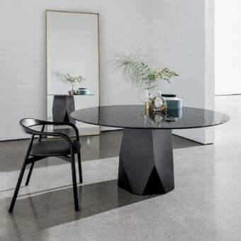 Exclusive Sovet Italia Deod round table with a sculptural matte black lacquered metal base and dark reflective liquid glass tabletop