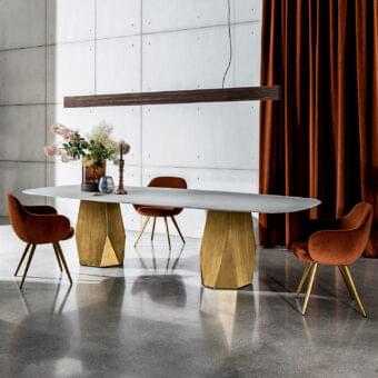 Superior Sovet Italia Deod table with geometrically faceted bases and ceramic-laminated tabletop in pale off-white with golden lacquered metal