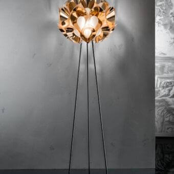 Innovative Slamp Flora floor lamp with sixty petals surrounding a satin sphere in glossy golden aluminum and matte black legs