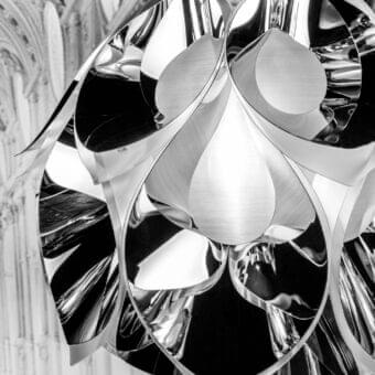 Distinguished Slamp Flora lamp suspension crafted with sixty petal-like forms in reflective silver and innovative aluminum vaporization finish