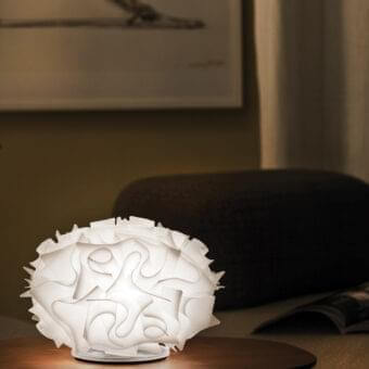 Exceptional Slamp Veli table lamp crafted in embossed Opalflex® with overlapping white elements emitting warm diffused light