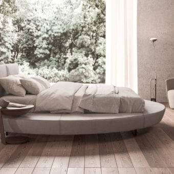 Innovative Presotto Zero bed with light gray textile upholstery and padded particleboard with solid pinewood base