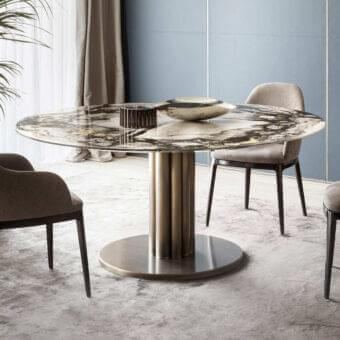 Distinguished Rugiano Forest round table with marble-like stone top and warm-toned metal pedestal base in satin finish