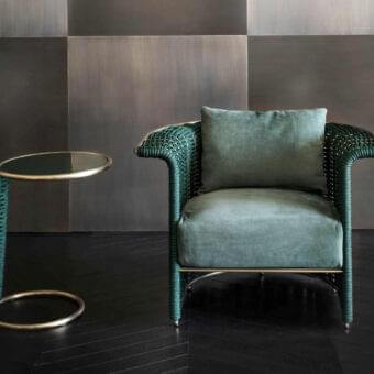 Sophisticated Rugiano Marina lounge chair with muted green velvety fabric upholstery and satin gold metal structure