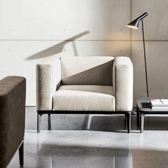 Refined Sovet Italia Slim lounge chair with light neutral beige European fabric upholstery and polished chrome finish