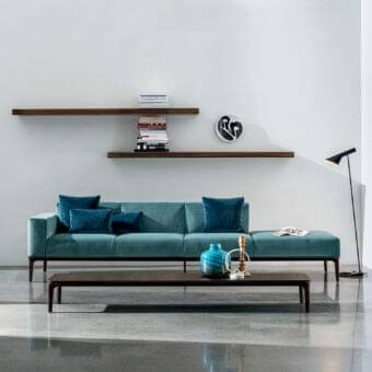 Elegant Sovet Italia Slim sofa with teal European fabric upholstery and a dark-toned wooden frame
