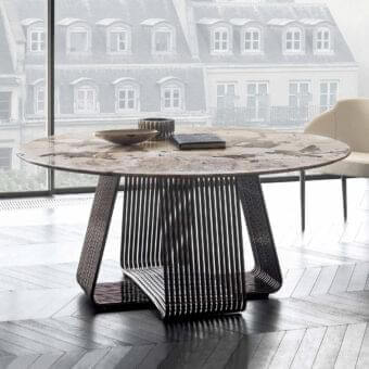 Elegant Rugiano Alyson round table with curved black chrome metal tubes and refined beige and gray mottled marble tabletop