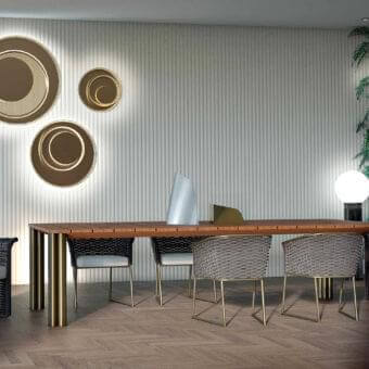 Sophisticated Rugiano Atlante table with rectangular Iroko wood showcasing horizontal grain and glossy bronze metal legs