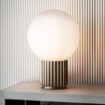 Distinguished Rugiano Liberty table lamp with satin bronze base and milky white glass lampshade
