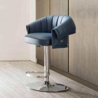 Distinguished Rugiano Manta stool with quilted blue fabric upholstery and polished metal base construction