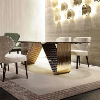 Distinguished Rugiano Alyson table with curved light gold metal tubes and a sleek transparent glass tabletop crafted with a polished finish