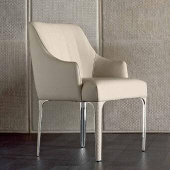 Elegant Rugiano Arianna armchair crafted in neutral beige fabric resembling leather with polished chrome metal legs and matelassé embroidery detailing