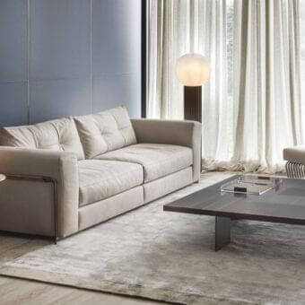 Superior Rugiano Arthur sofa upholstered in light beige textile with smooth matte finish and black chrome armrests