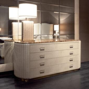 Superior Rugiano Bach dresser with curved silhouette, leather upholstery and marble top, finished with dark metallic pulls