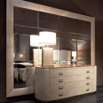 Lavish Rugiano Bach dresser with curved silhouette, leather drawers and a brass-like finish marble top