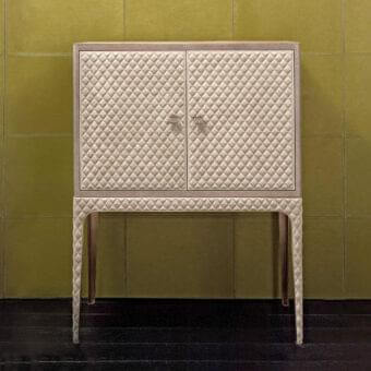 Distinguished Rugiano Ciry cupboard crafted in Italy with beige leather and golden steel metal details exhibiting matelassé embroidery