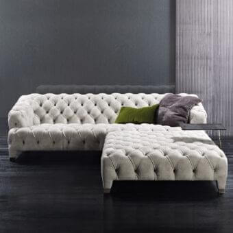 Elegant Rugiano Cloud sofa with quilted, textured fabric and tufted finish in pale beige, olive green and dark gray cushions