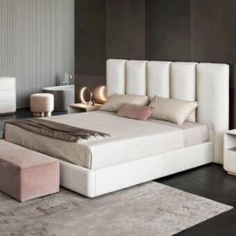 Distinctive Rugiano Club bed crafted in neutral creamy leather or fabric with brushed gold-toned trim accents