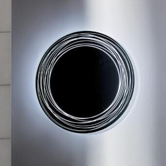Superior Sovet Italia Vertigo mirror crafted with glass and black rings in a glossy finish